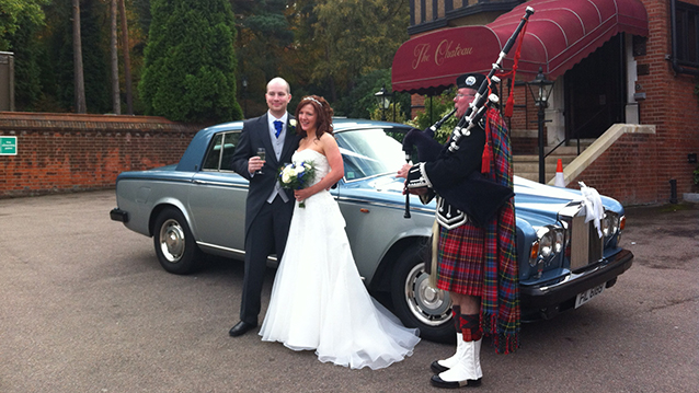 Rolls-Royce Silver Shadow II with Bride and Groom and a pipe player wearing traditional uniform