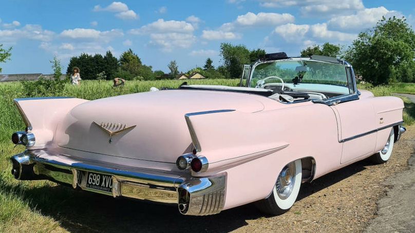 Rear view of Pink Cadillac Eldorado Biarritz Convertible showing the iconic fin tail 