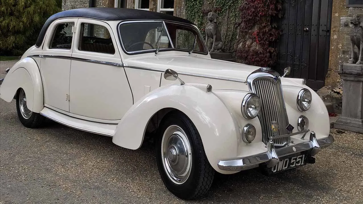 Classic Wedding Car in Ivory and Black roof.