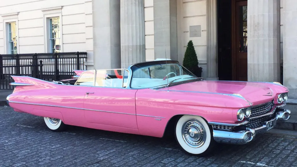 Pink Cadillac Convertible with convertible roof down