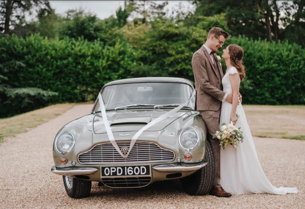 Having Adrian with us for our wedding made an already perfect day even more special with service that was outstanding in every way! The Aston Martin is absolutely beautiful, and Adrian was so kind and accommodating, putting us at ease and making us feel so special. We cannot recommend him enough and feel so grateful to have had him with us on our big day! Thank you so much Adrian, from Matt &amp; Laura. (Photo: Emily Hudson)