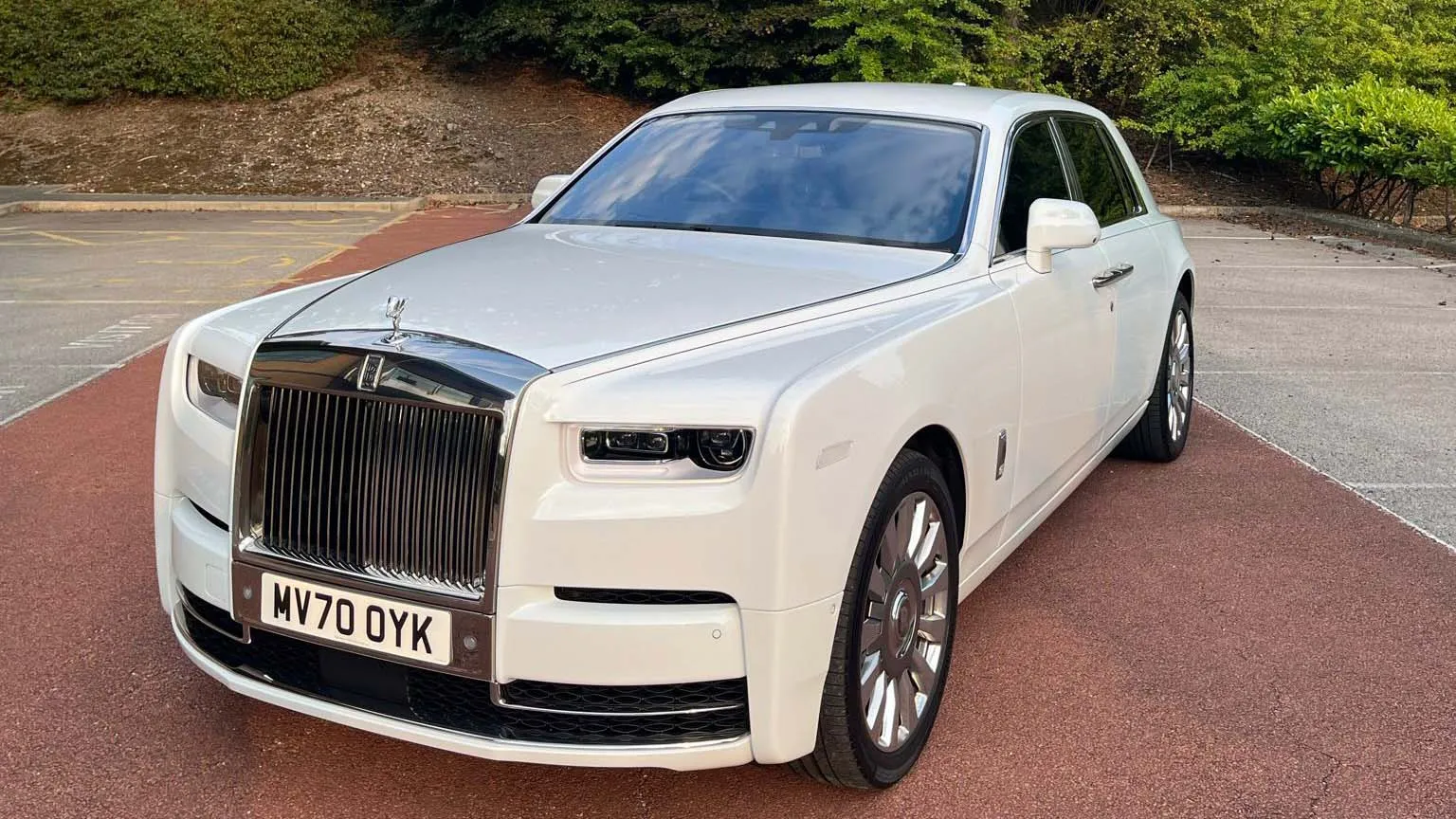 White Rolls-Royce Phantom 8 parked in front