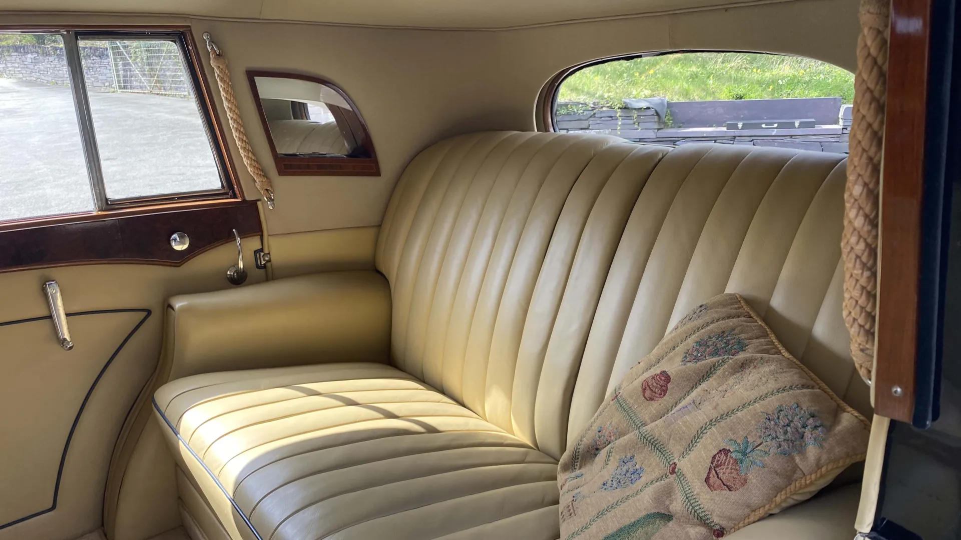 Rolls-Royce Sedanca de Ville inside view of cream leather bench seat