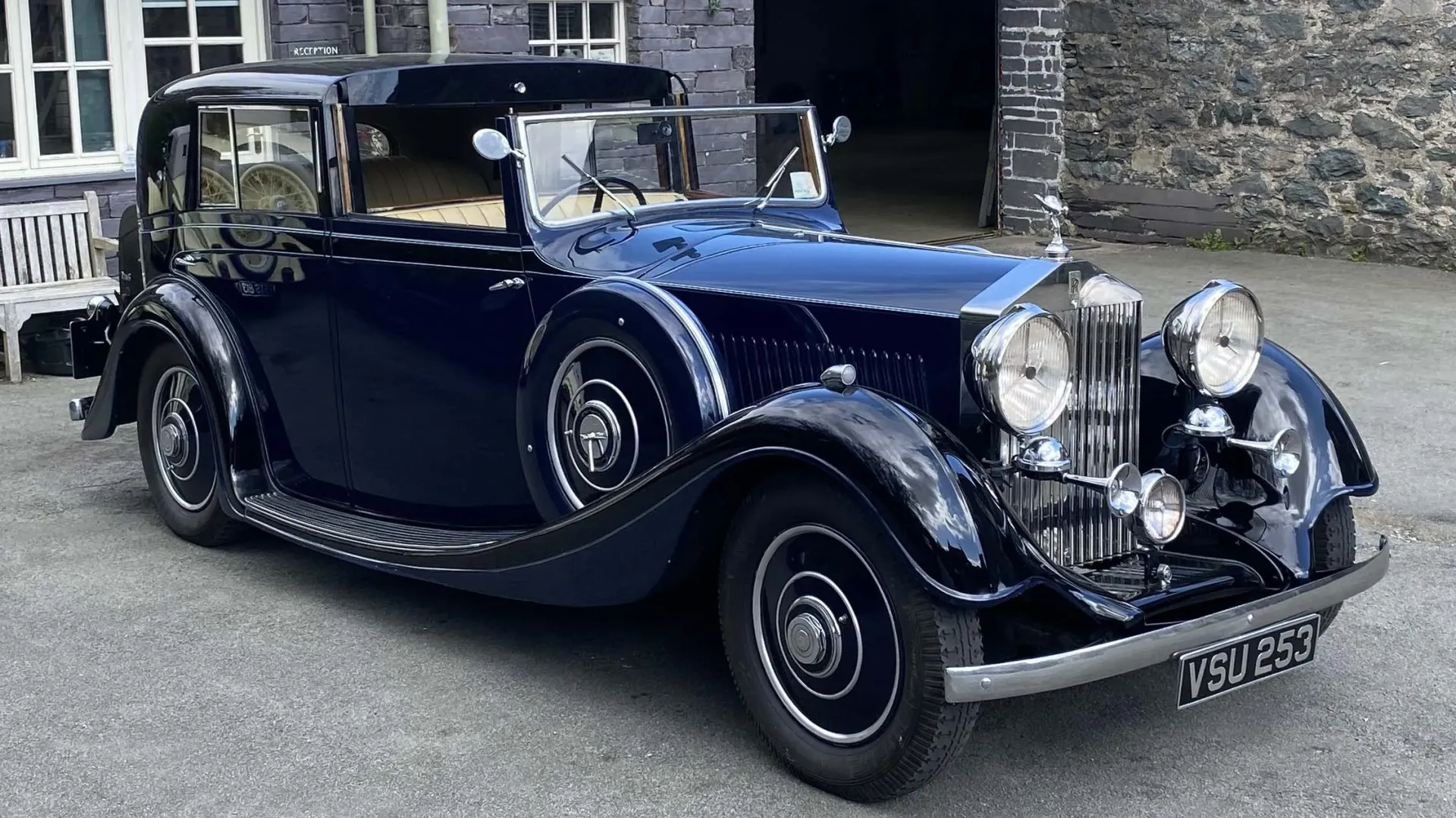 Front side view Blue Vintage Rolls-Royce Sedanca de Ville showing mounted head lights