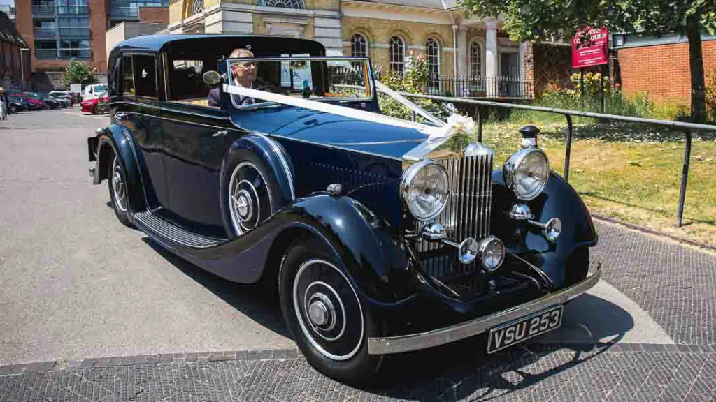 Rolls-Royce Sedanca de Ville decorated with white ribbons