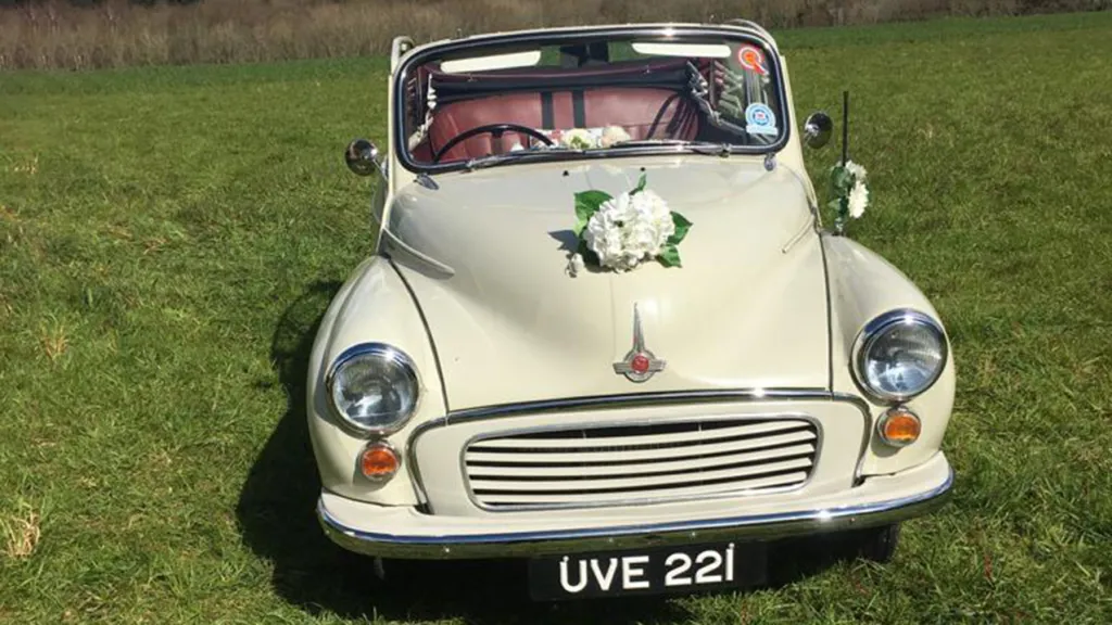Morris Minor front facing view with flower decoration on bonnet